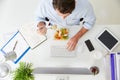 Overhead View Of Businessman Working At Computer In Office