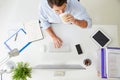 Overhead View Of Businessman Working At Computer In Office