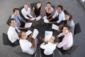 Overhead View Of Businesspeople Seated In Circle At Company Semi Royalty Free Stock Photo