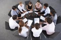 Overhead View Of Businesspeople Seated In Circle At Company Seminar Royalty Free Stock Photo