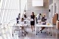 Overhead View Of Businesspeople Working At Desks In Office Royalty Free Stock Photo