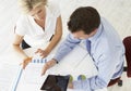 Overhead View Of Businesswoman And Businessman Working At Desk T