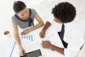 Overhead View Of Businesswoman And Businessman Working At Desk Together Royalty Free Stock Photo