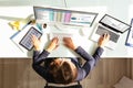 Businesswoman Doing Multitasking Work In Office