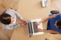 Overhead View Of Businesswomen Using Laptop In Office