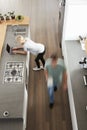 Overhead View Of Busy Couple In Modern Kitchen Royalty Free Stock Photo