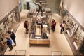 Overhead View Of Busy Museum Interior With Visitors