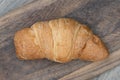 Overhead view of butter breakfast croissant served fresh from the oven on a wooden platter Royalty Free Stock Photo