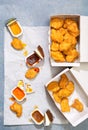 Overhead view of chicken nuggets with sauce