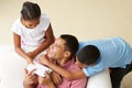 Overhead View Of Children Giving Father Gift