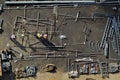 Construction workers sort components in a storage yard on site.JPG