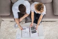 Overhead View Of A Couple Calculating Bills Royalty Free Stock Photo