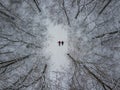 overhead view couple laying on the snow in winter forest Royalty Free Stock Photo