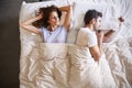 Overhead View Of Couple With Relationship Problems Lying In Bed Royalty Free Stock Photo