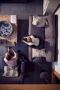 Overhead View Of Couple Relaxing On Lounge Sofa At Home And Playing Computer Game Together Royalty Free Stock Photo