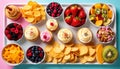 Overhead View of Cupcakes Chips Berries and Fruits on Serving Tray in Studio Royalty Free Stock Photo