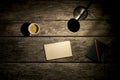 Overhead view of desk lamp, coffee, notebook and blank piece of