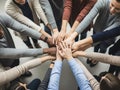 Diverse team hands stacked in unity for a collaborative effort Royalty Free Stock Photo