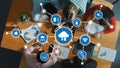 Aerial View of Professionals Collaborating on Cloud Computing Strategies with Data Visualizations and Technology Icons Royalty Free Stock Photo