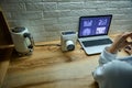 Overhead view of a radiologist doctor dentist analyzing panoramic x-ray on laptop screen monitor in dentist office. Dental