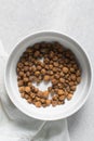 Overhead view of dried tiger nuts in a white bowl Royalty Free Stock Photo