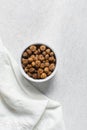 Overhead view of dried tiger nuts in a white bowl Royalty Free Stock Photo