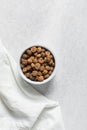 Overhead view of dried tiger nuts in a white bowl Royalty Free Stock Photo