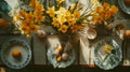 Overhead view of an Easter table setting with narcissus flowers and eggs on plates. Eating utensils on a festive set Royalty Free Stock Photo