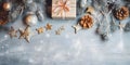 An overhead view of elegantly stacked gifts, stars, pinecones, pine branches and Christmas trees.Christmas banner with space for