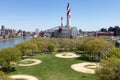 Empty Green Grass Sports Fields at Queensbridge Park during Spring in Long Island City Queens New York next to a Power Plant