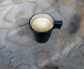 Overhead view of an espresso cup of freshly brewed coffee. Royalty Free Stock Photo