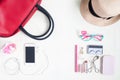 Overhead view of essential beauty items, Top view of smartphone, red hand bag, fashion eyeglasses and cosmetic