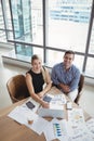 Overhead view of executives using laptop at desk Royalty Free Stock Photo