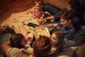 Overhead View Of Family Enjoying Movie Night At Home Together Royalty Free Stock Photo