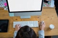 Overhead view of female graphic designer working over computer at desk Royalty Free Stock Photo