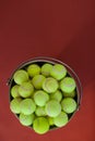 Overhead view of fluorescent yellow tennis balls in bucket