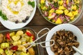 Overhead view of four savory vegetable dishes