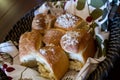 Overhead View of Freshly Baked Cheese-Topped Rolls in Rustic Basket Royalty Free Stock Photo