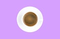 Overhead view of a freshly brewed mug of espresso coffee isolated on purple background. Coffee break style concept. Royalty Free Stock Photo