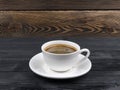 Overhead view of a freshly brewed mug of espresso coffee on rustic wooden background with woodgrain texture. Coffee break style Royalty Free Stock Photo