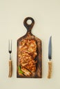 Top view of fried chopped pork tenderloin on wooden cutting board Royalty Free Stock Photo