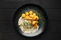 Overhead view of fried zander fillet with mushroom sauce and potato balls Royalty Free Stock Photo