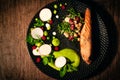 Overhead view grill smoked salmon with red beans, chick peas, cannellini beans, kale, cottage cheese