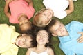 Overhead View Of Group Of Children Smiling At Camera