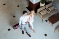 overhead view of happy couple of travelers walking with luggage Royalty Free Stock Photo