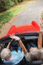 Overhead view of happy mature couple going for a ride together Royalty Free Stock Photo