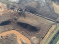 Overhead view of huge earth moving works taking place on a large construction site Royalty Free Stock Photo