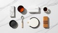 Overhead View of Kitchen Utensils and Coffee Cup Arranged on a White Marble Surface Royalty Free Stock Photo