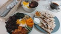 Overhead view of korean and mexican dish combination for brunch