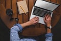 overhead view of man using laptop with google website while sitting at table with coffee Royalty Free Stock Photo